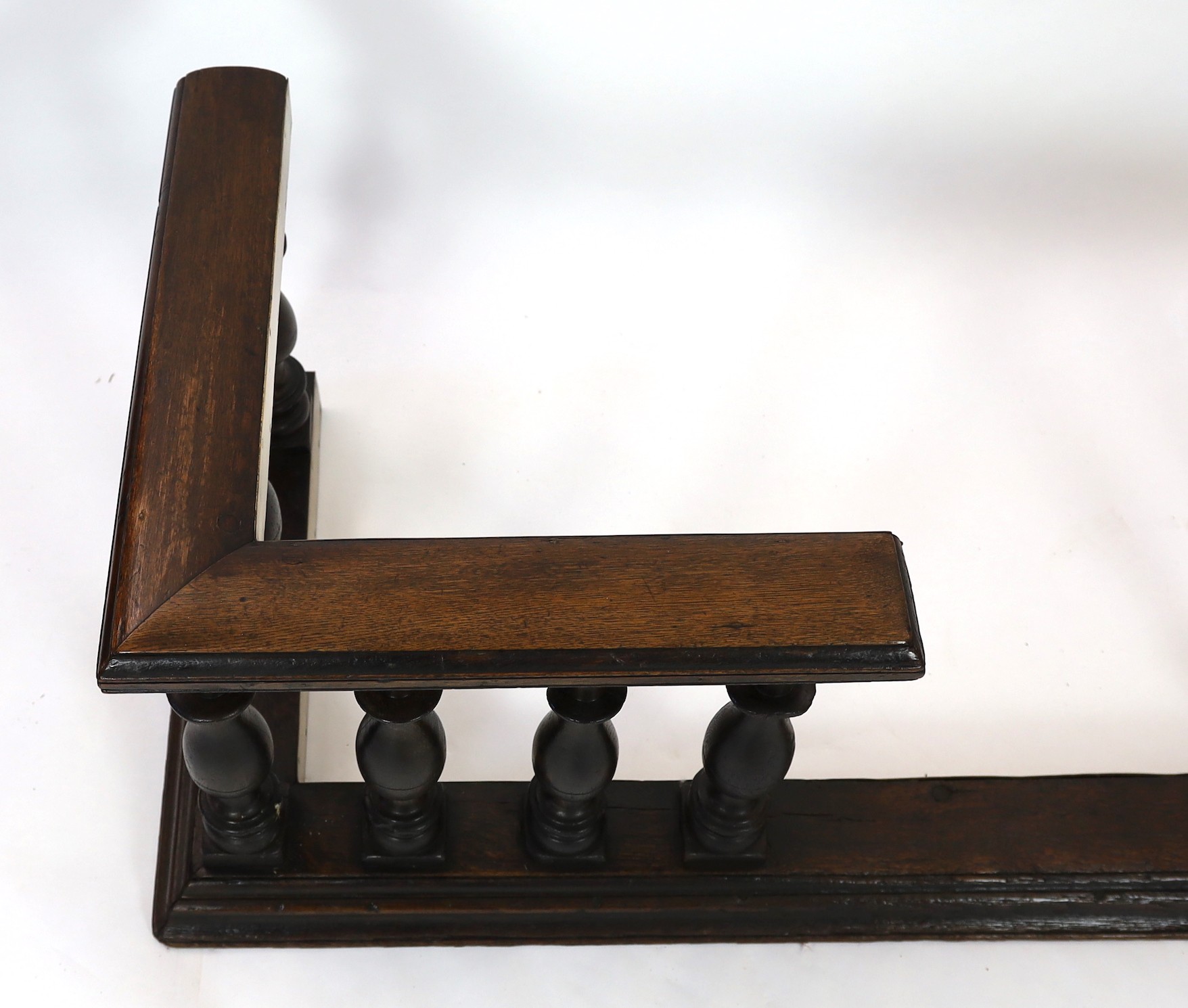 A 19th century brass mounted oak club fender, width 182cm depth 69cm height 58cm